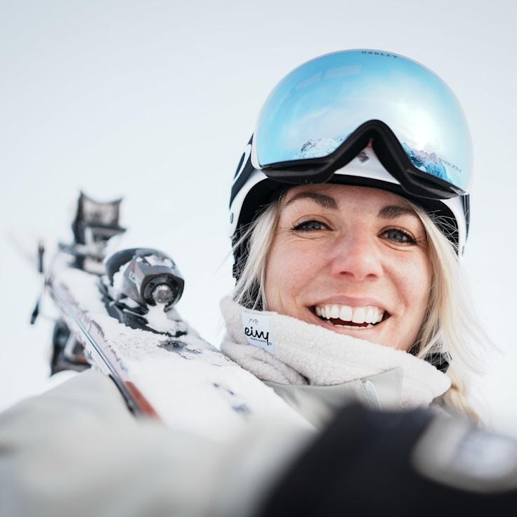 Aisha Rao, Lead Design Curator at StudioHarborVista, reviewing corporate floral arrangements